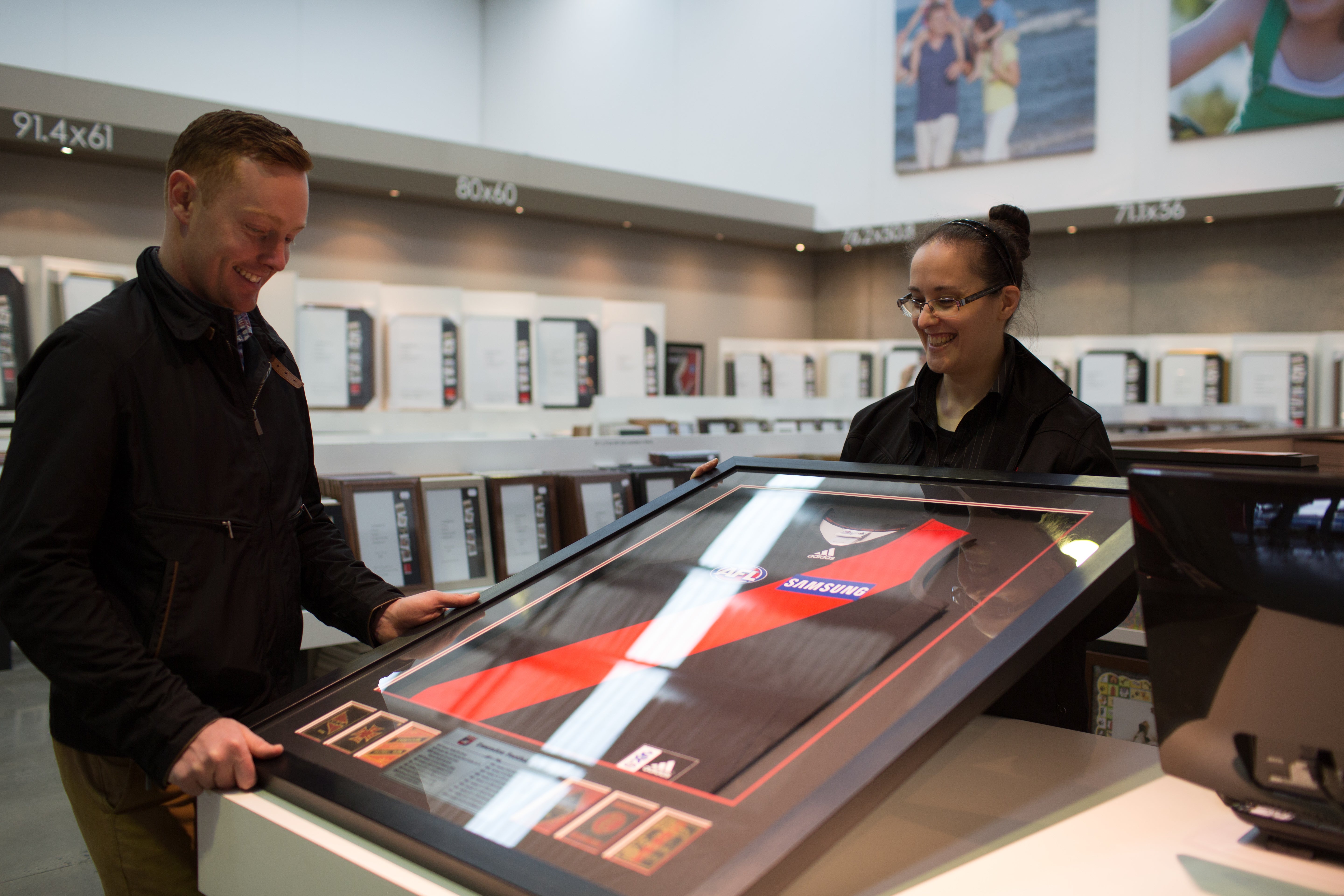 black afl guernsey framing. footy jumper frame with black moulding